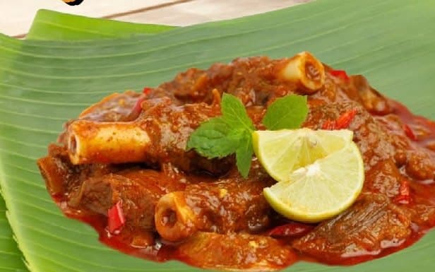 Mutton masala on a banana leaf, from Thanjai's menu photography